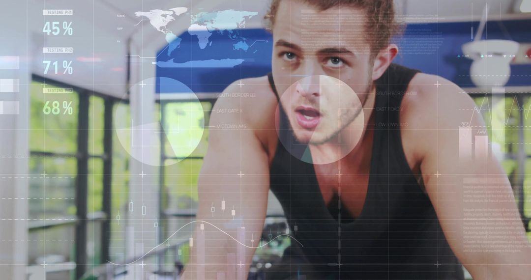 Fit Male Cyclist Training with Digital Analytics in Modern Gym