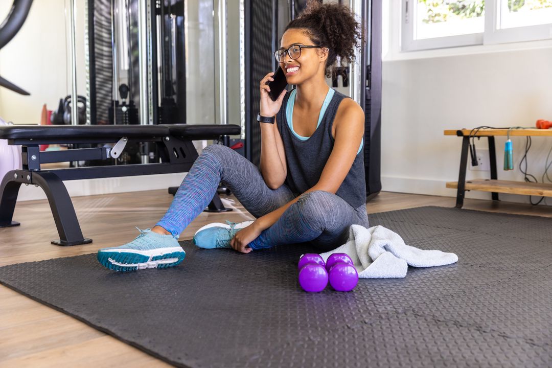 Active Woman Engaging in Home Workout While on Call