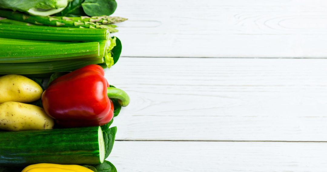 Assorted Fresh Vegetables on Rustic Wooden Table with Copy Space