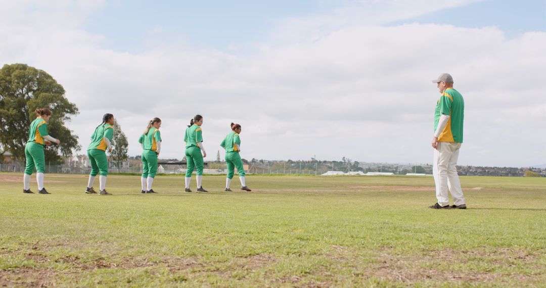 Diverse Softball Team Preparing for Outdoor Practice