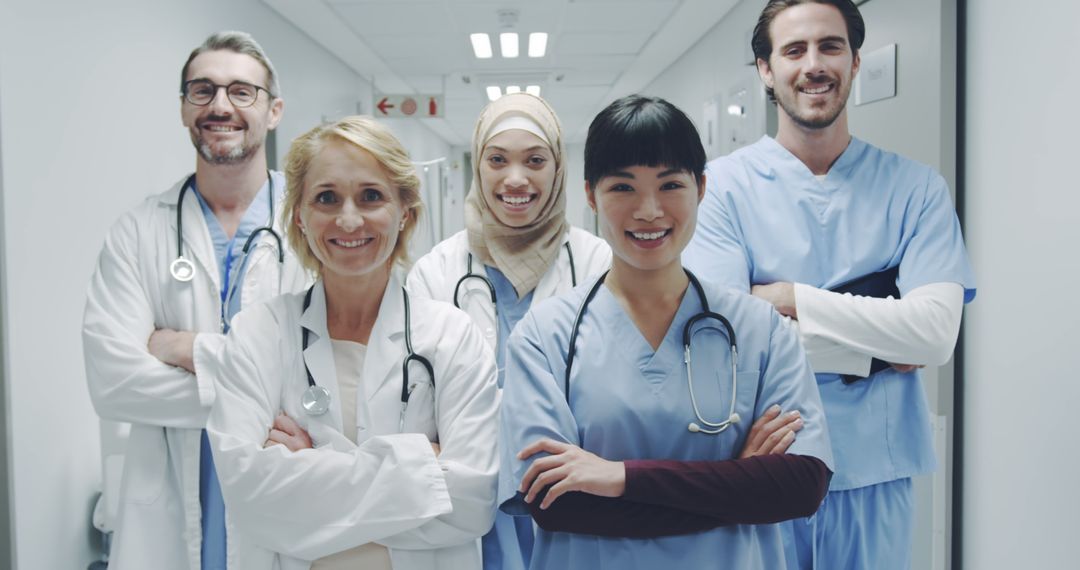 Diverse Healthcare Team Confidently Standing in Hospital Hallway - Free Images, Stock Photos and Pictures on Pikwizard.com