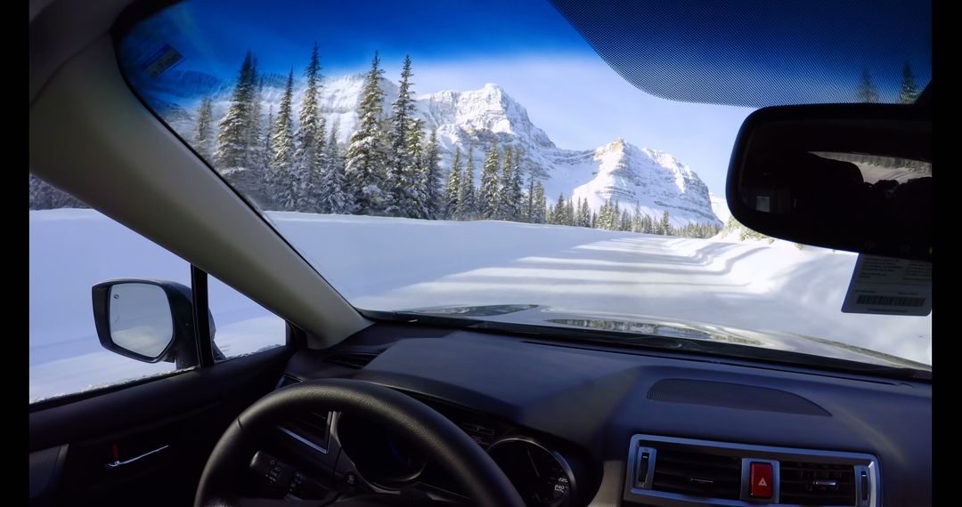 Driving Through Scenic Snowy Mountain Road in Winter - Free Images, Stock Photos and Pictures on Pikwizard.com