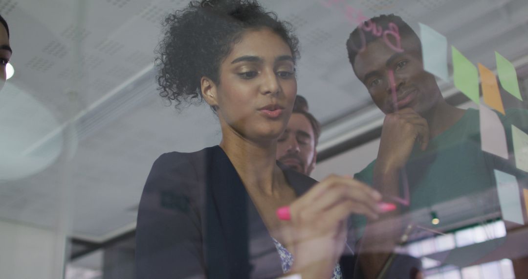 Diverse Team Collaborating on Office Presentation