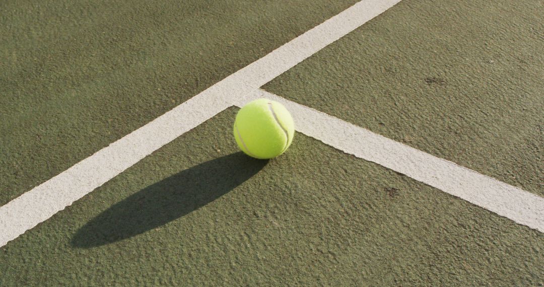 Tennis Ball on Floor with Shadow in Sunlight - Free Images, Stock Photos and Pictures on Pikwizard.com