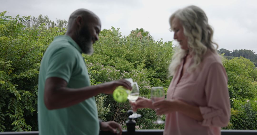 Adults Relaxing with Wine on Scenic Balcony