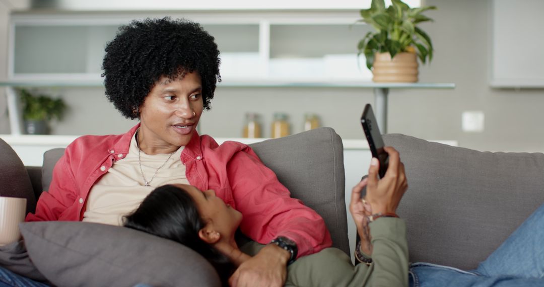 Diverse Couple Relaxing on Couch Sharing Quality Time
