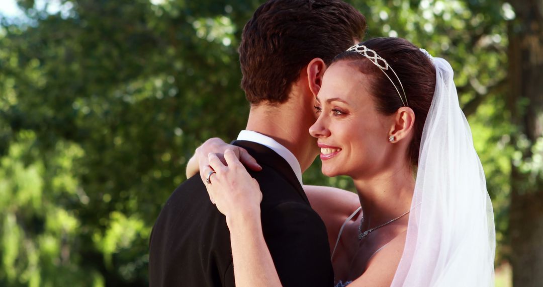 Smiling Bride Embracing Groom Outdoors Wedding Ceremony - Free Images, Stock Photos and Pictures on Pikwizard.com