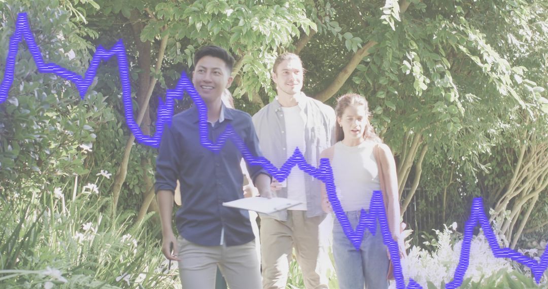 Young professionals walking through sunlit garden holding clipboard with graph overlay