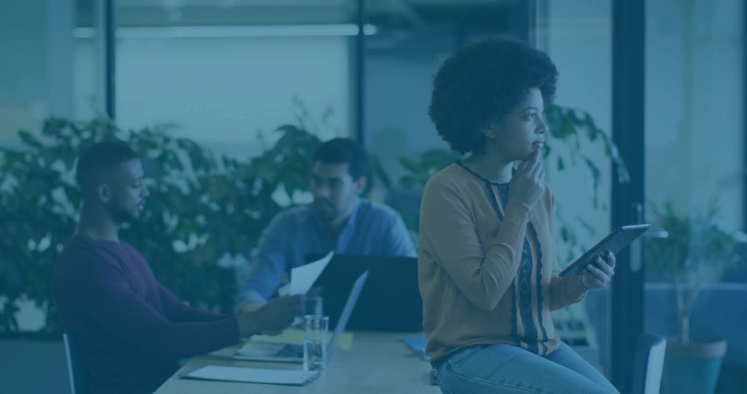 Professional Business Woman Analyzing Data on Tablet in Trendy Office