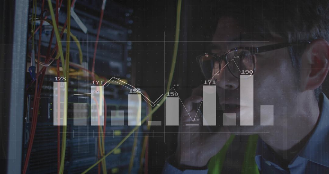 IT Technician Monitoring Server Room with Digital Graph Overlay