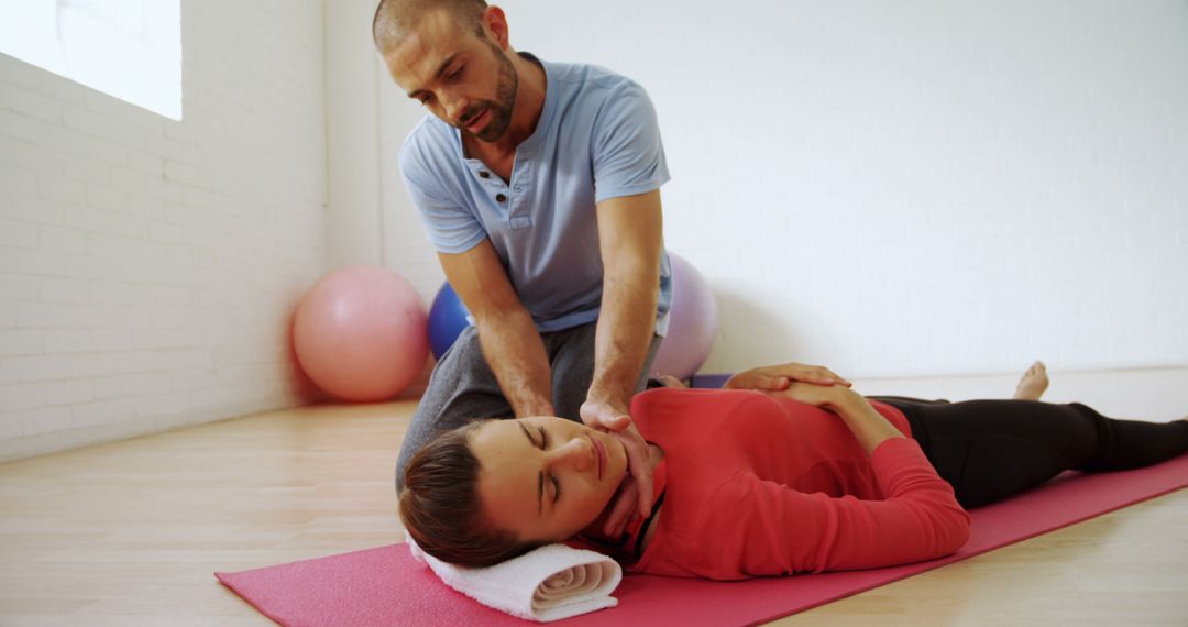 Physical Therapist Providing Treatment to Woman - Free Images, Stock Photos and Pictures on Pikwizard.com