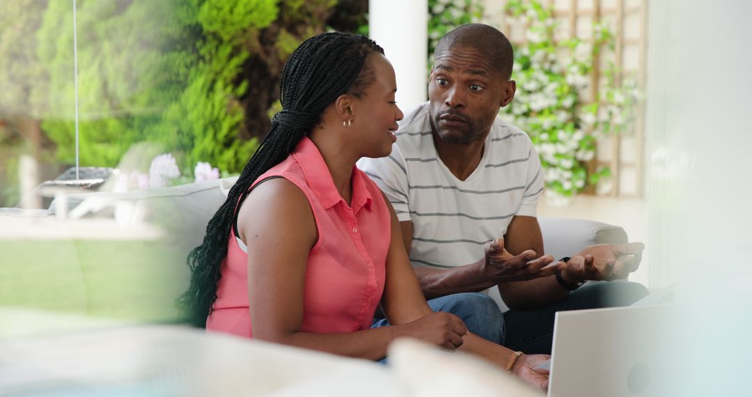 Mature Couple Planning Finances at Home Using Technology