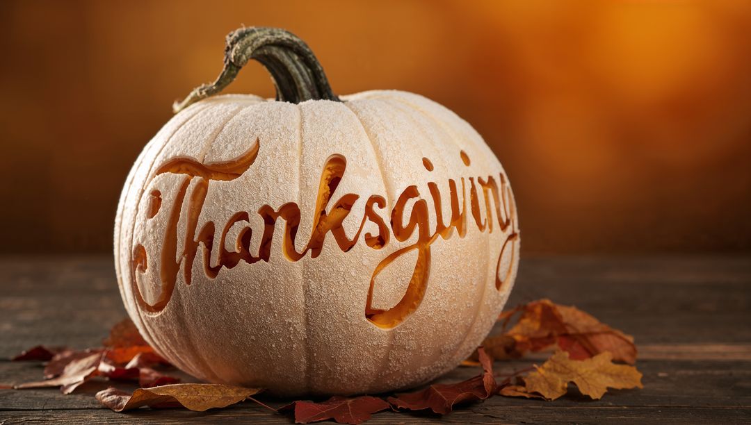 Cream Pumpkin Carved Thanksgiving Script Glowing Centerpiece on Rustic Wood Table