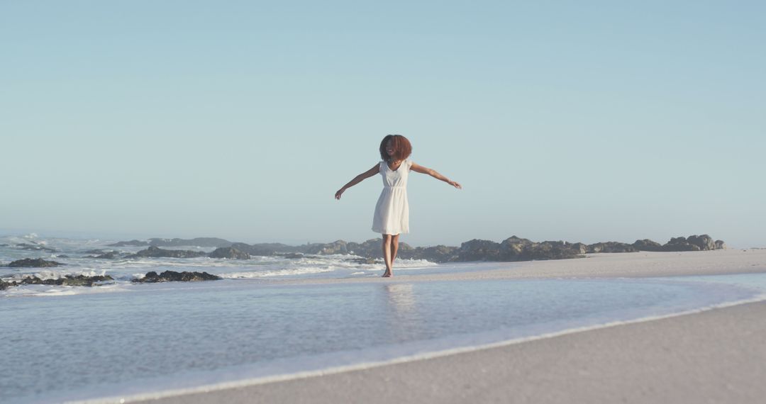 Woman Enjoying a Peaceful Moment on a Beach - Free Images, Stock Photos and Pictures on Pikwizard.com