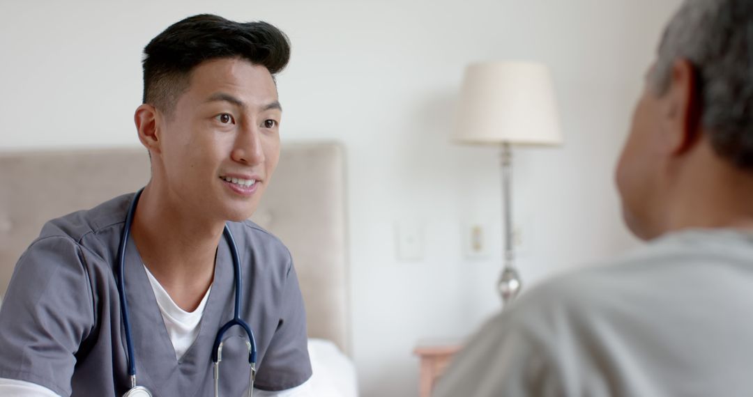 Young Male Nurse Interacting with Senior Patient During Home Visit - Free Images, Stock Photos and Pictures on Pikwizard.com