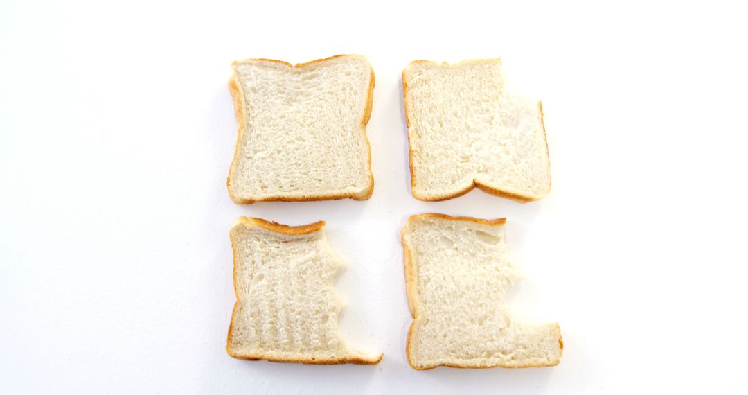 White Bread Slices with Bites on White Background - Free Images, Stock Photos and Pictures on Pikwizard.com