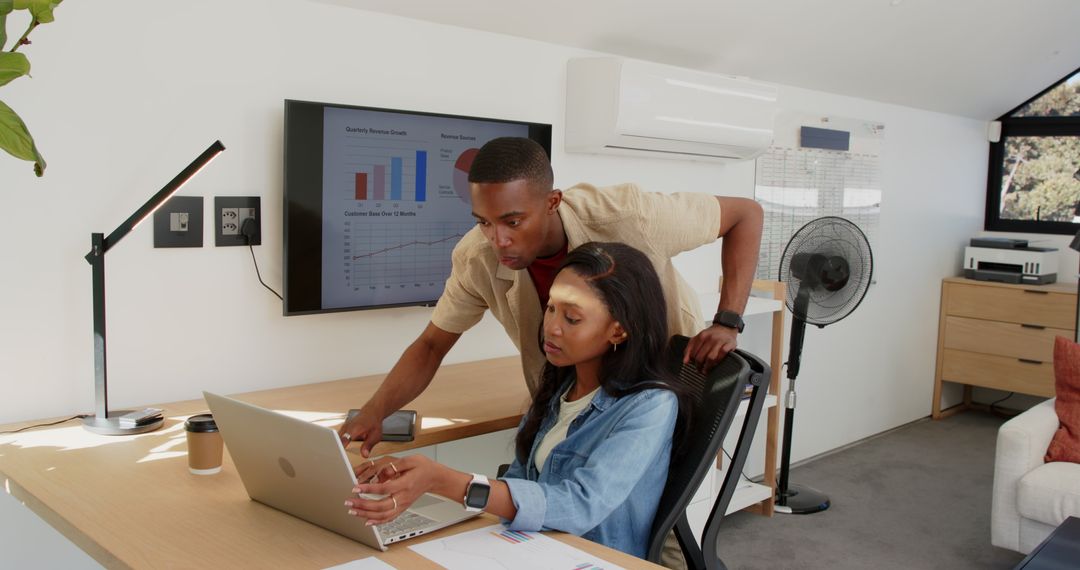 Collaborative Teamwork in Modern Home Office with Laptop