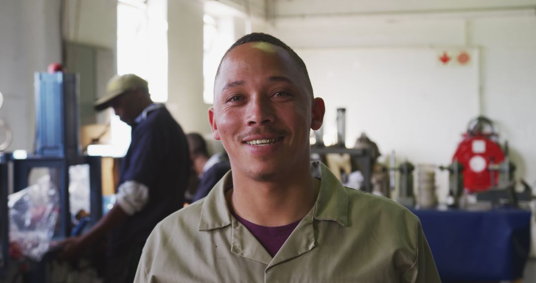 Confident Worker Smiling in Industrial Workshop