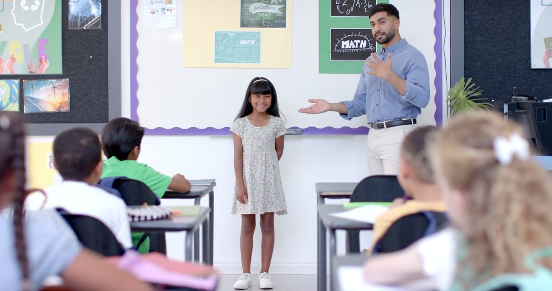 Teacher Applauding Confident Student Giving Classroom Presentation
