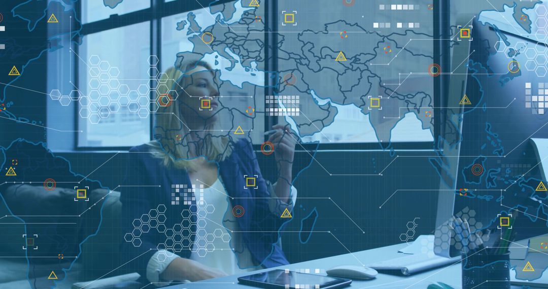 Professional Analyst Using Stylus for Digital Mapping Overlay