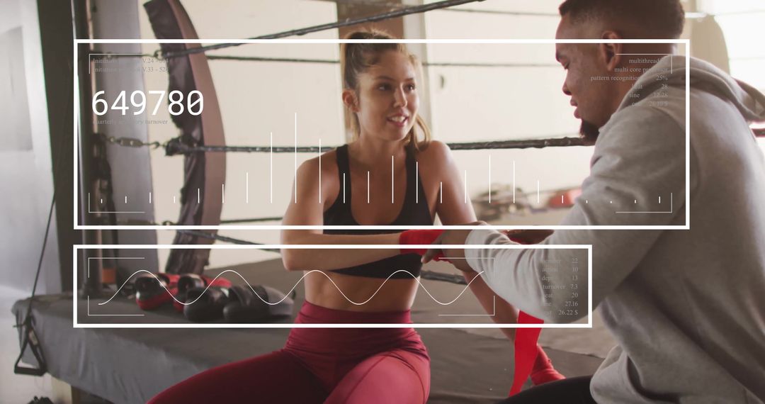 Mixed-Race Couple Training in Gym with Digital Interface Overlay