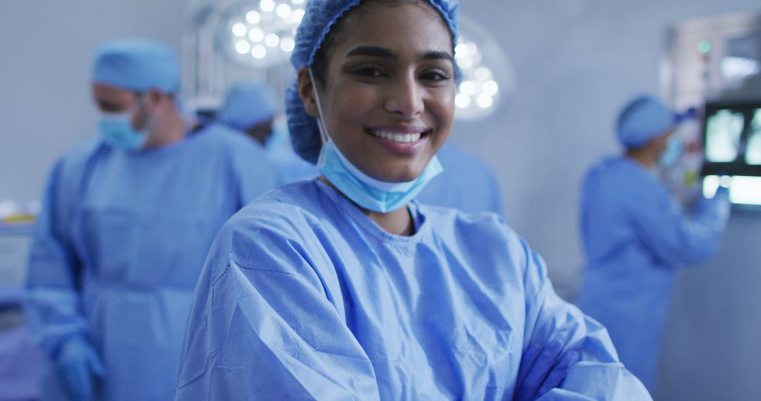 Smiling Female Surgeon Preparing for Surgery in Operating Room - Free Images, Stock Photos and Pictures on Pikwizard.com