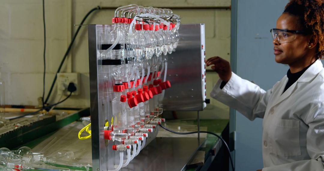 Female Scientist Working in Laboratory with Scientific Equipment - Free Images, Stock Photos and Pictures on Pikwizard.com