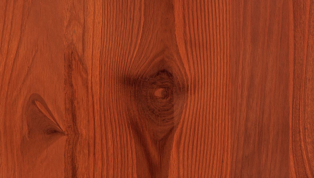 Reddish Brown Wood Plank Featuring Prominent Knot Grain Close-Up Rustic Timber Surface