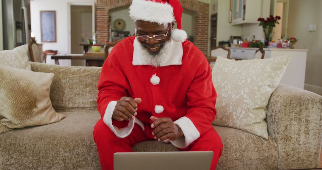 Santa Claus Video Calling from Cozy Living Room during Christmas Season - Free Images, Stock Photos and Pictures on Pikwizard.com