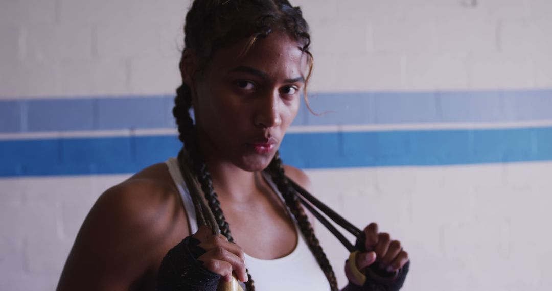 Determined Female Boxer Preparing for Training - Free Images, Stock Photos and Pictures on Pikwizard.com