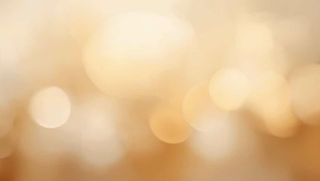 Glowing Warm Bokeh Background with Cream to Amber Light Orbs