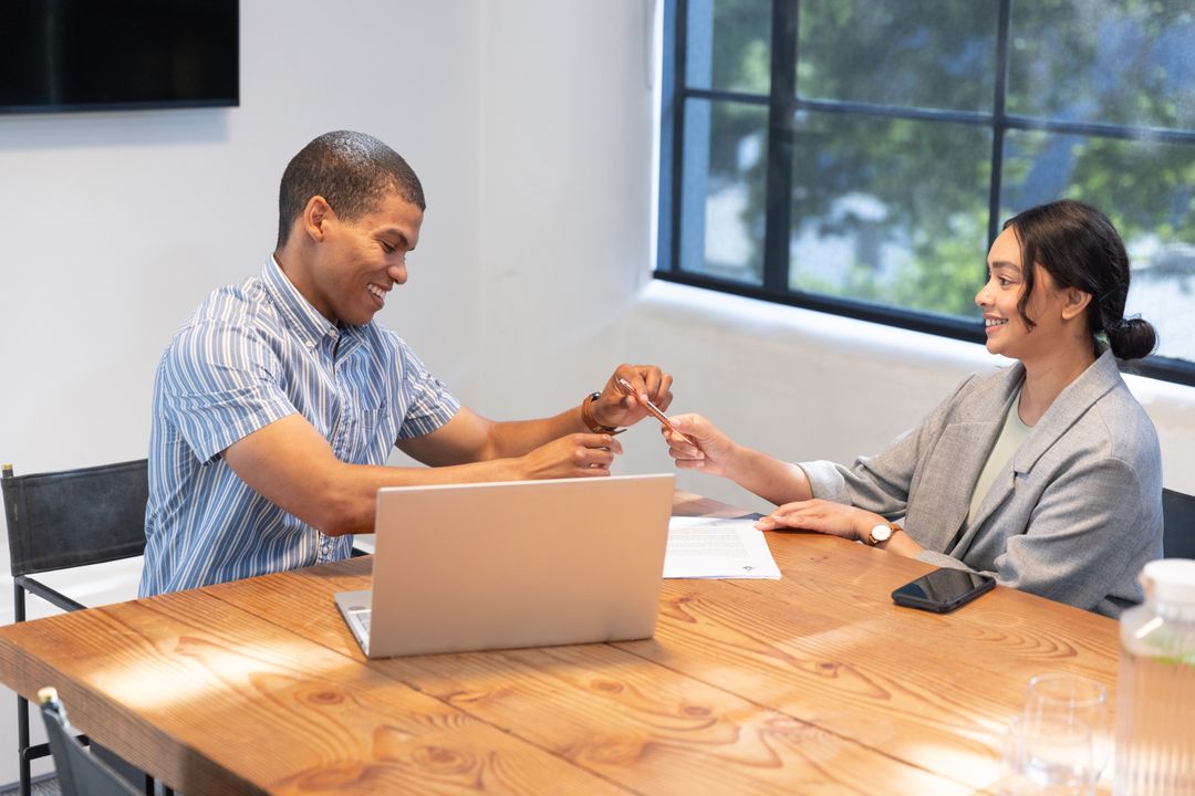 Diverse Coworkers Exchanging Ideas in a Modern Office Setting