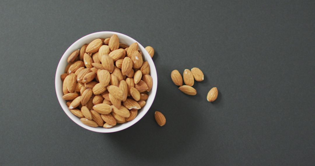Almonds in Bowl on Grey Background for Healthy Vegan Diet