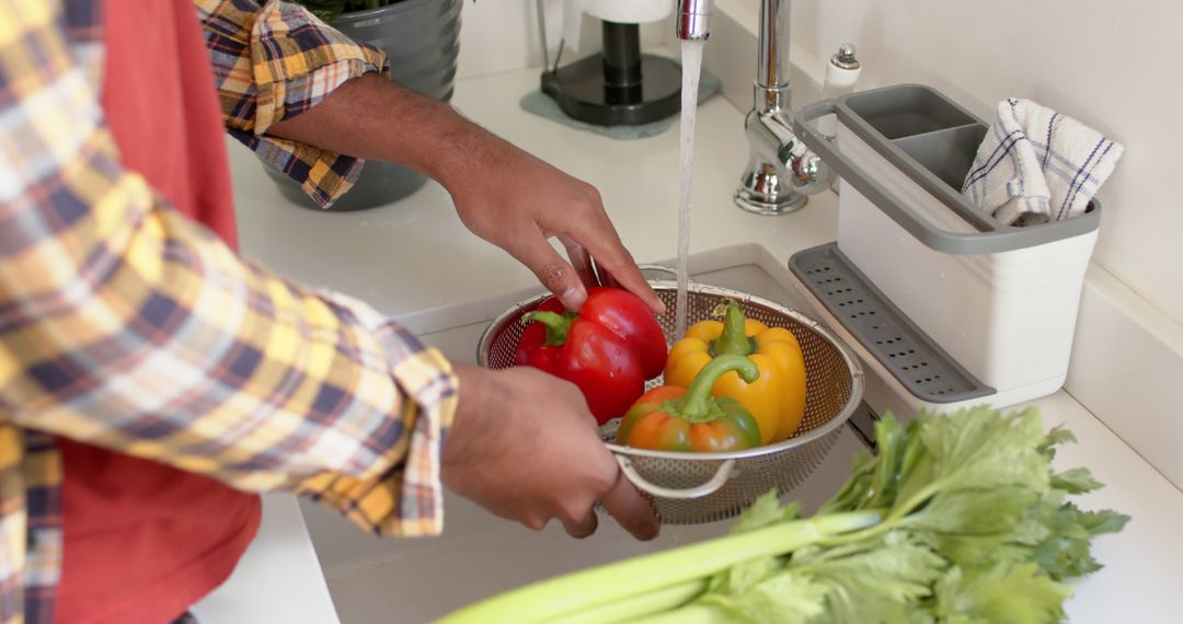 Person Washing Colorful Bell Peppers in Kitchen Sink - Free Images, Stock Photos and Pictures on Pikwizard.com