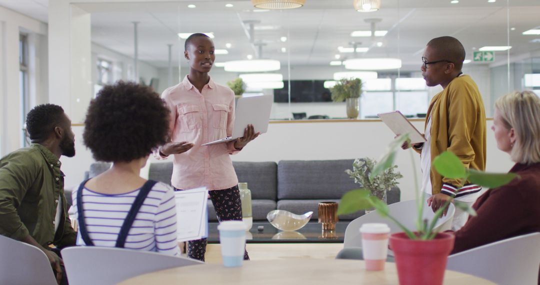 Diverse Team Engaging in Productive Meeting at Modern Office
