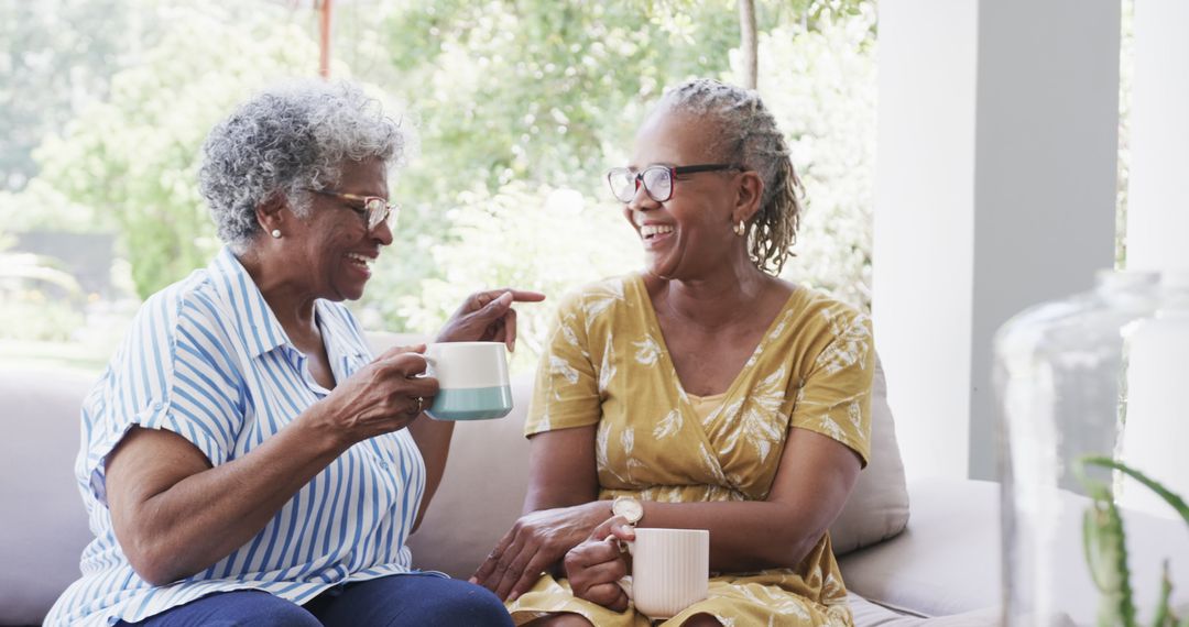 Joyful Senior Women Enjoying Coffee and Conversation