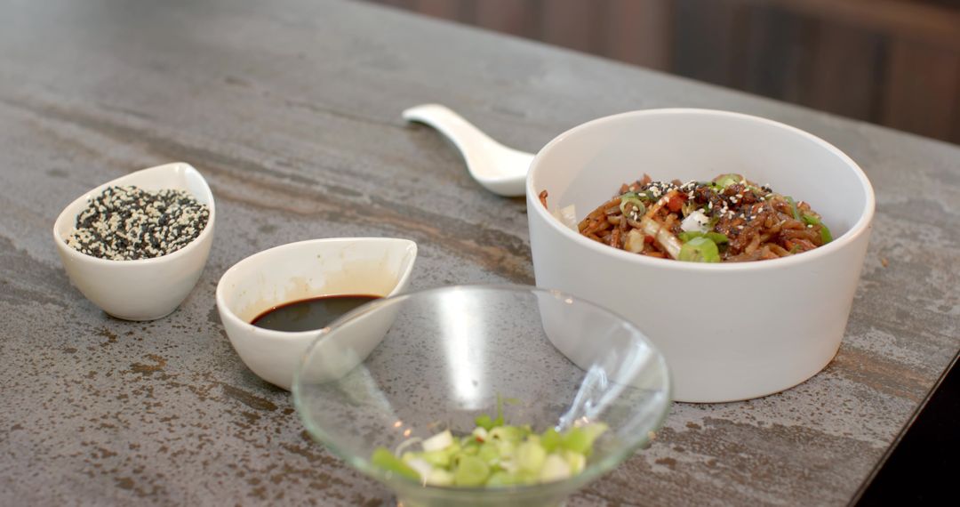 Gourmet Rice with Scallions and Sesame Seeds on Rustic Counter