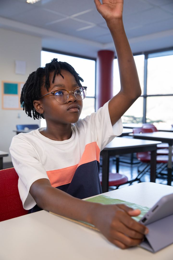 Engaged Student Participating in Classroom with Tablet