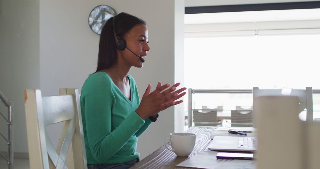 Woman in Headset Video Conferencing at Home