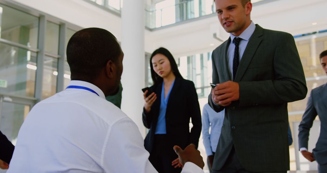 Diverse Business Professionals Queuing at Conference Registration