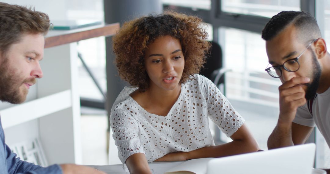 Focused Business Team Collaborates in Modern Office