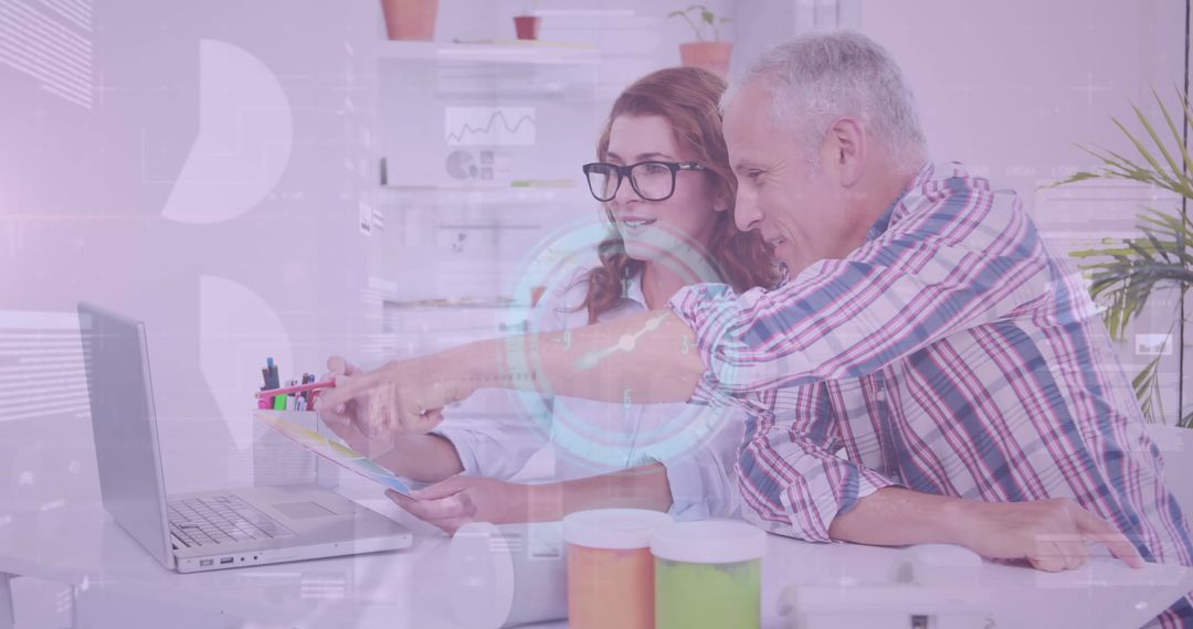 Senior Business Team Analyzing Financial Data with Digital Graphics