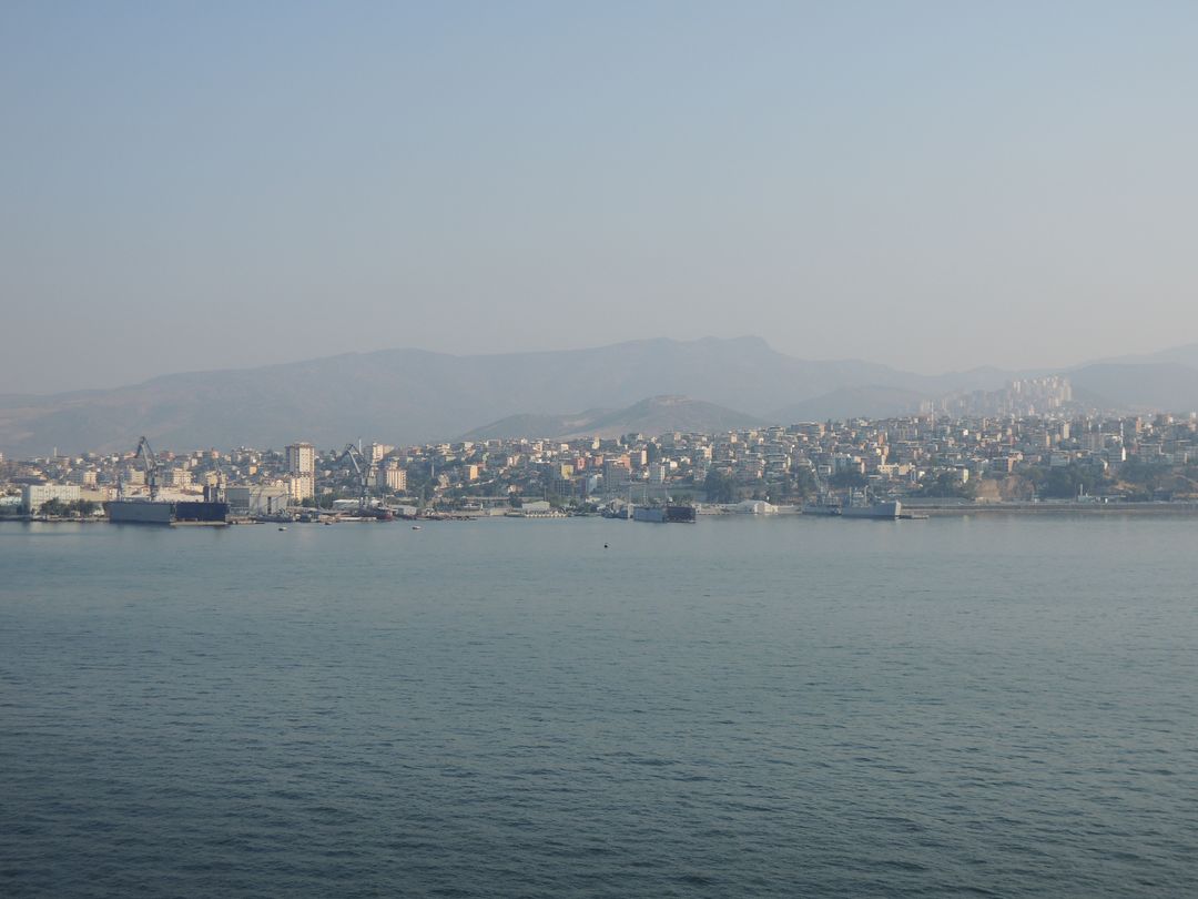 Scenic Coastal City View With Distant Mountains