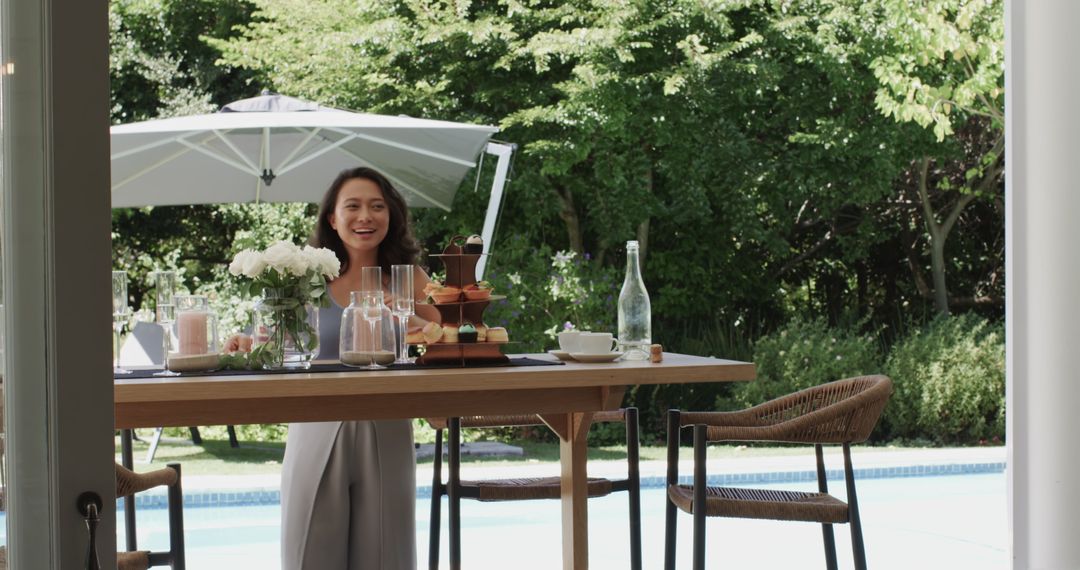 Woman Delightfully Enjoying Outdoor Brunch by Poolside