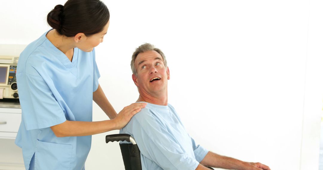 Nurse Assisting Elderly Patient in Wheelchair - Free Images, Stock Photos and Pictures on Pikwizard.com