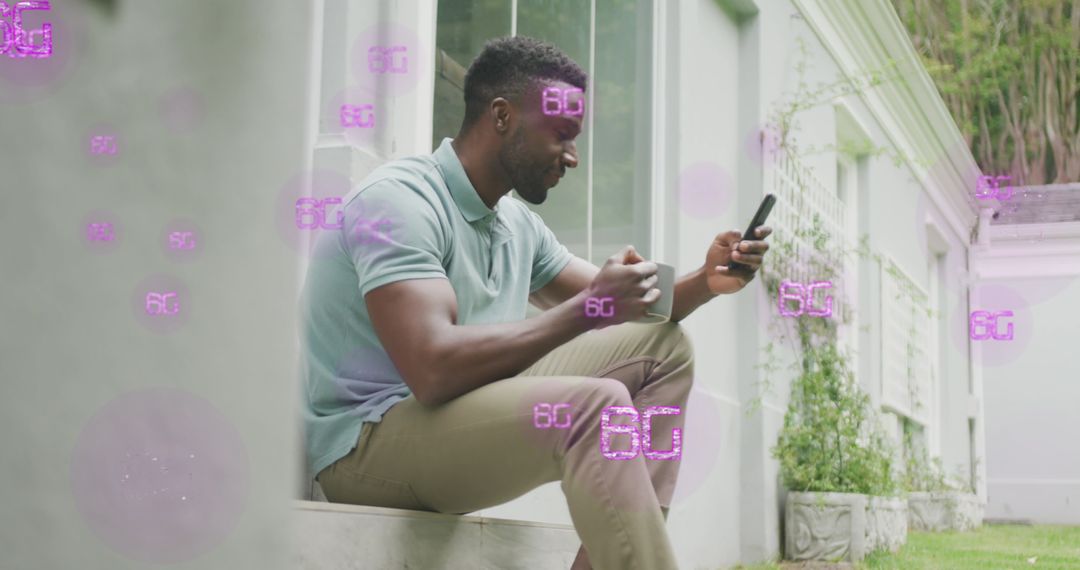 Man Engaging with Smartphone Surrounded by Futuristic 6G Symbols