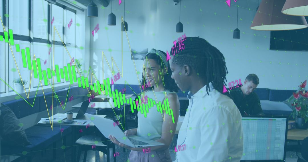 Coworkers Analyzing Financial Graphs for Business Planning