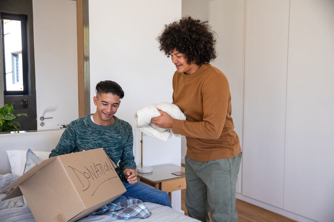 Caring Friends Packing Donation Box for Charity Together