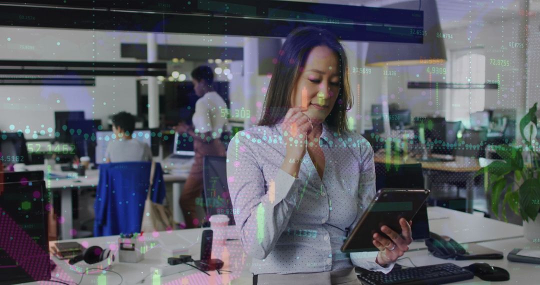 Businesswoman Analyzing Digital Financial Statistics on Tablet