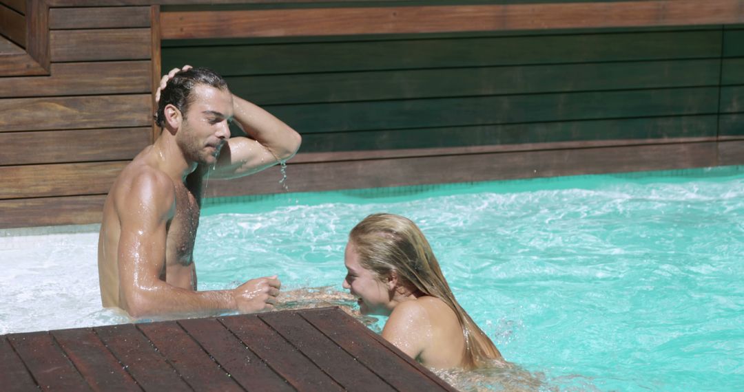 Young Couple Relaxing in Swimming Pool on Sunny Day - Free Images, Stock Photos and Pictures on Pikwizard.com